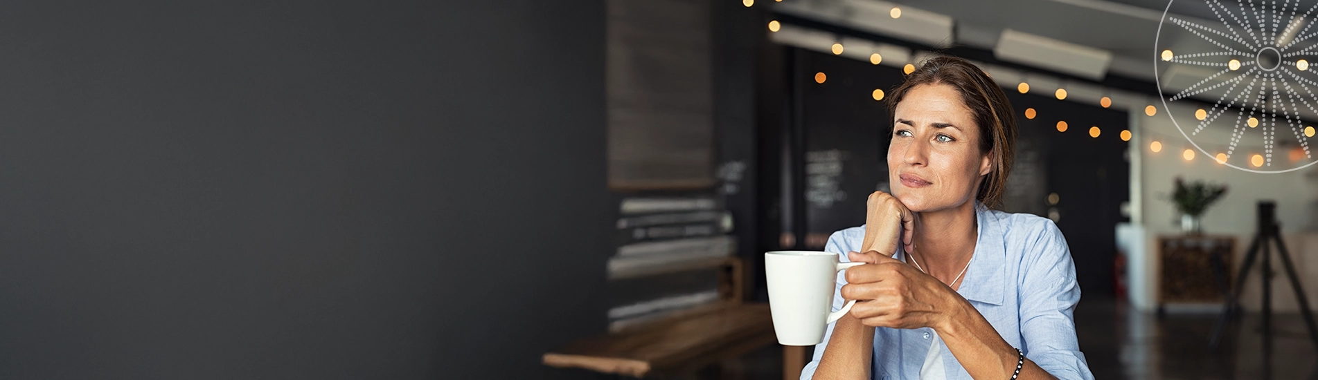 woman in kitchen with cup of espresso